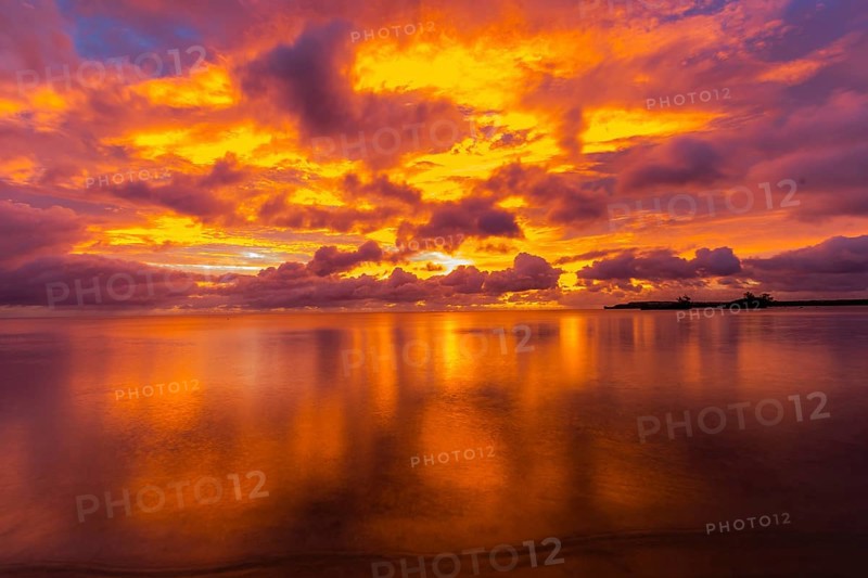 Beautiful sunset over ocean water taken from a beach in Guam
