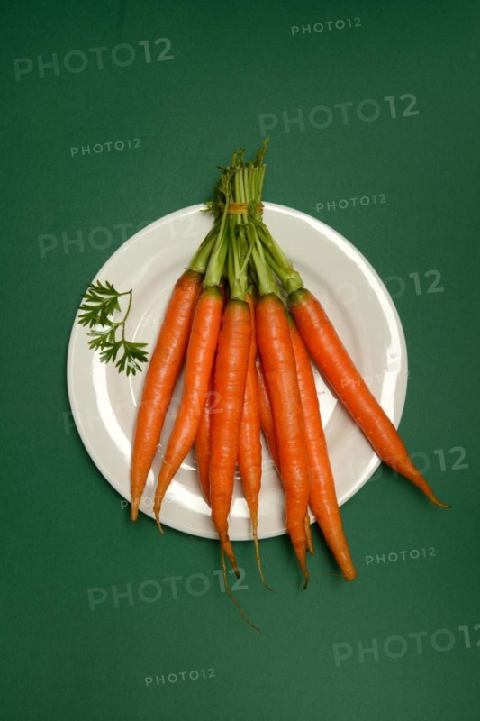 A bunch of carrots on a plate, Daucus carota, carrots
