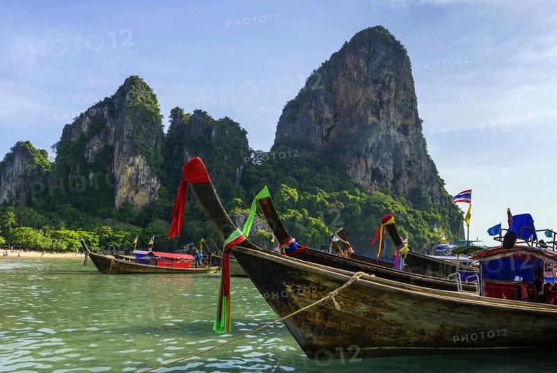 Longtail boat for transporting tourists, water taxi, taxi boat, ferry, ferry boat, fishing boat, wooden boat, boat, decorated, tradition, traditional, bay, sea, ocean, Andaman Sea, tropics, tropical, chalk cliffs, landscape, island, water, travel, tourism, paradisiacal, beach holiday, sun, sunny, holiday, dream trip, holiday paradise, paradise, coastal landscape, nature, idyllic, turquoise, Siam, exotic, travel photo, Krabi, Thailand, Asia