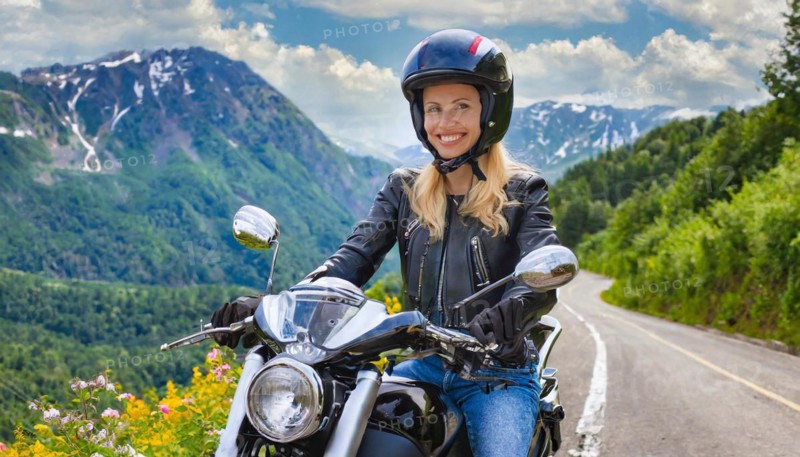 AI generated, An attractive woman rides her motorbike through an autumn landscape