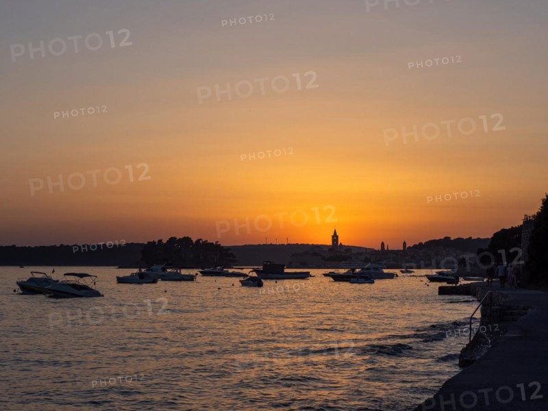 Sunset over a bay near the town of Rab, island of Rab, Kvarner Gulf Bay, Croatia, Europe