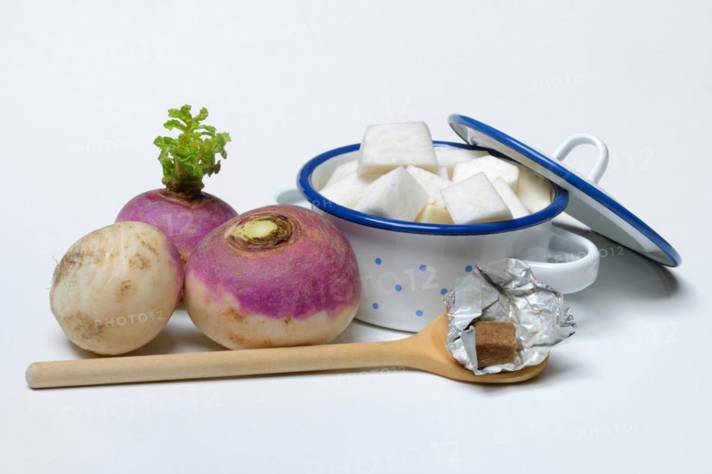 Purple beetroot and sliced beetroot in pot, cooking spoon with stock cube, Brassica rapa
