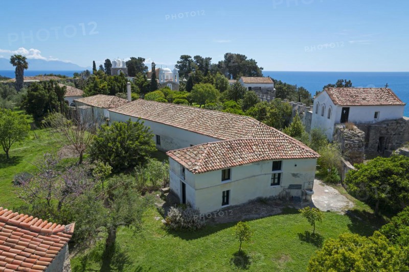 Mediterranean architecture with churches and houses, surrounded by trees under a blue sky, view of the Holy Monastery of Timi Prodromos, Byzantine fortress, nunnery, Koroni, Pylos-Nestor, Messinia, Peloponnese, Greece, Europe