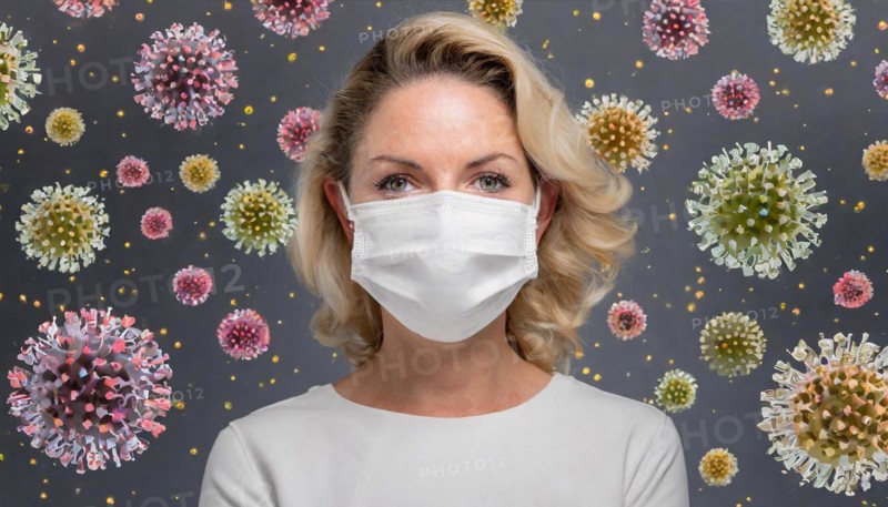 AI generated, A blonde woman protects herself from Corona, various viruses, Covid-19, FFP2 mask