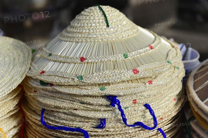 Pile of traditional Asian conical hats, decorated with various patterns, Inle Lake, Myanmar, Asia
