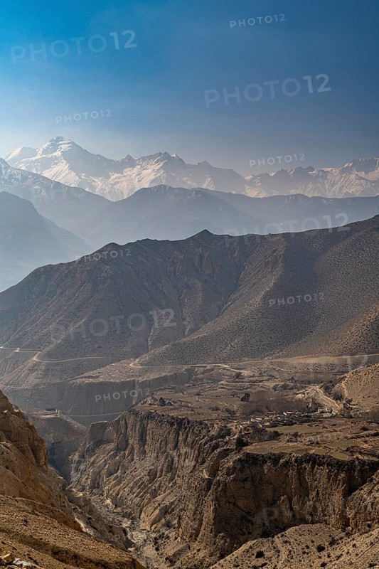 Desert mountain scenery with the Annapurna mountain range in the background, Kingdom of Mustang, Nepal, Asia