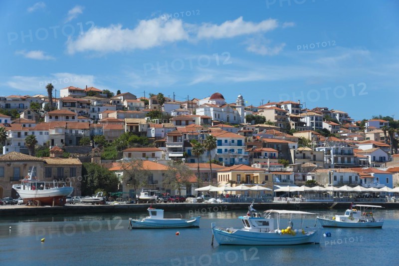 A picturesque coastal town on a sunny day with boats in the water, Koroni, Pylos-Nestor, Messinia, Peloponnese, Greece, Europe