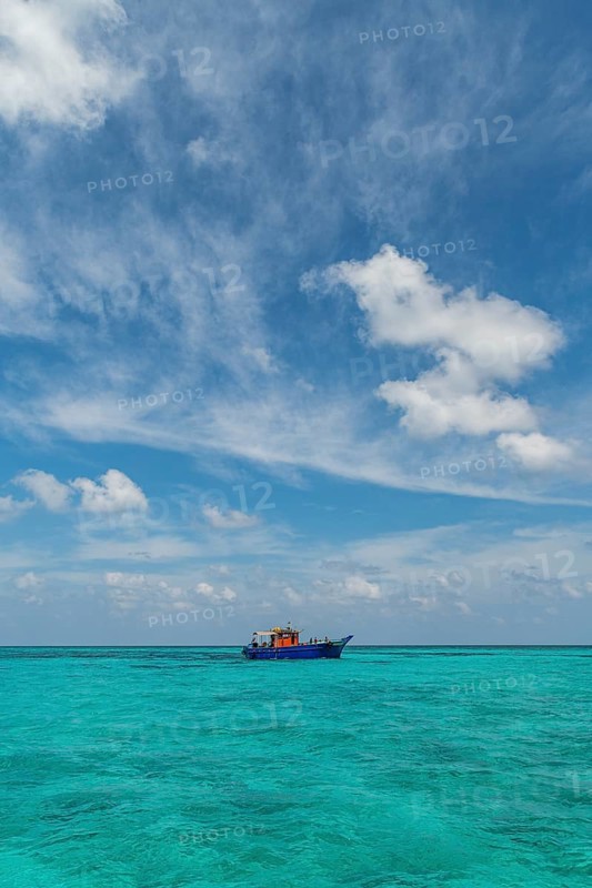 Little boat in the turquoise waters of Agatti Island, Lakshadweep archipelago, Union territory of India