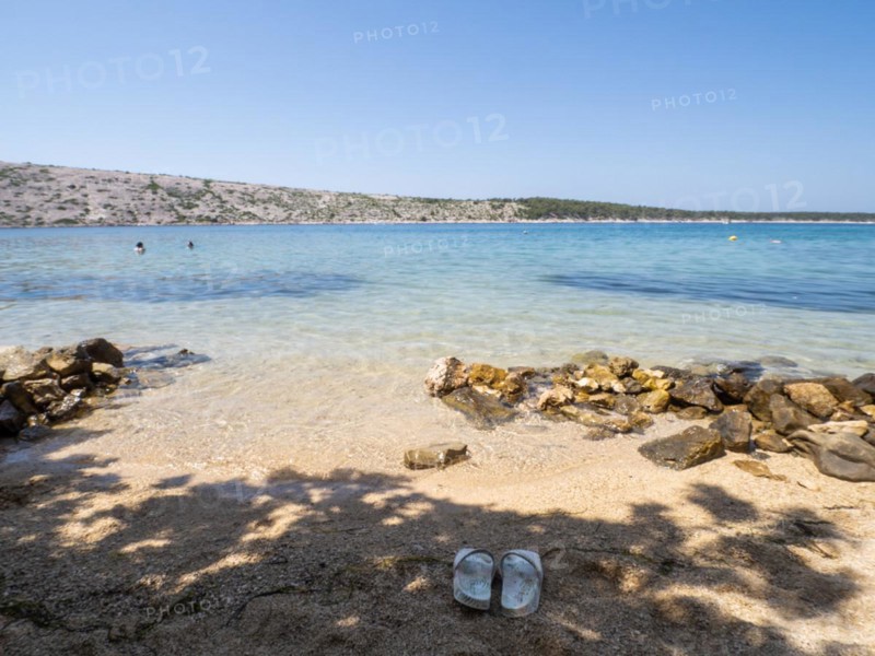 Bathing bay, beach shoes in the sand, island of Rab, Kvarner Gulf Bay, Croatia, Europe