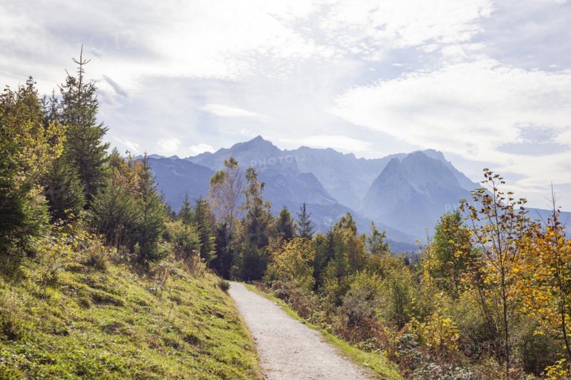 Wetterstein mountains with Alpspitze, Zugspitze massif and houses with hiking trail Philosophenweg, autumn, backlight, Garmisch-Partenkirchen, Upper Bavaria, Bavaria, Germany, Europe