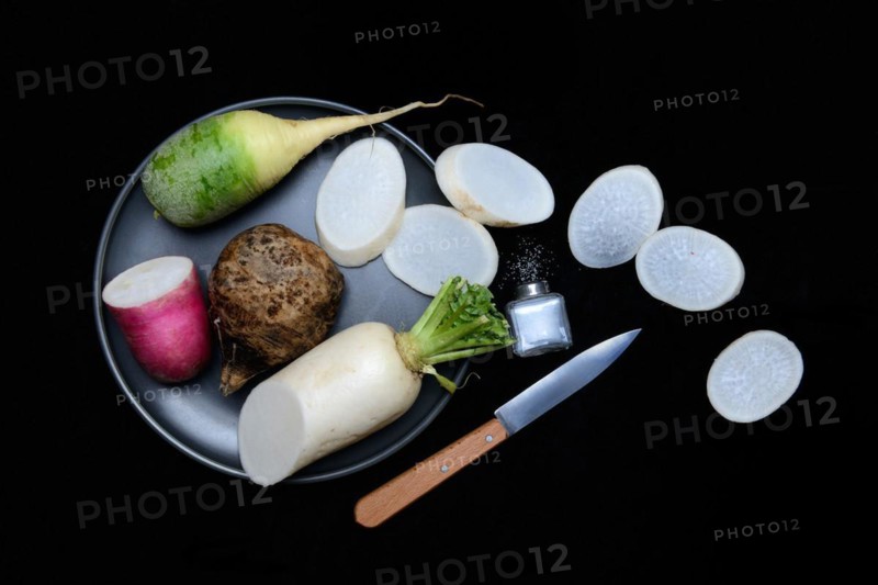Various radishes on a plate, sliced, Raphanus