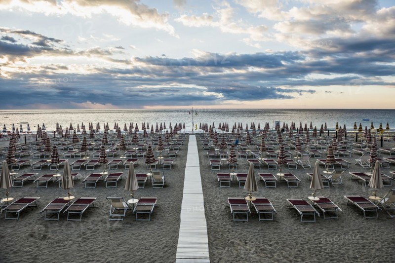 Empty beach and beach loungers, sunrise, Spotorno, Riviera di Ponente, Liguria, Italy, Europe