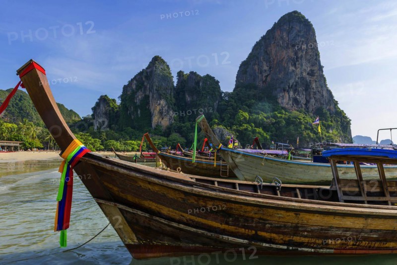 Longtail boat for transporting tourists, water taxi, taxi boat, ferry, ferry boat, fishing boat, wooden boat, boat, decorated, tradition, traditional, bay, sea, ocean, Andaman Sea, tropics, tropical, chalk cliffs, landscape, island, water, travel, tourism, paradisiacal, beach holiday, sun, sunny, holiday, dream trip, holiday paradise, paradise, coastal landscape, nature, idyllic, turquoise, Siam, exotic, travel photo, Krabi, Thailand, Asia