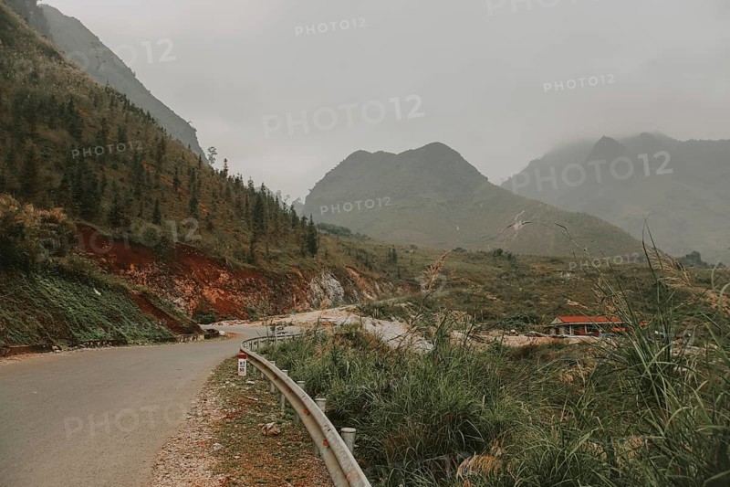 Cinematic foggy winding road to the karst mountains in Meo vac District, Ha giang Vietnam