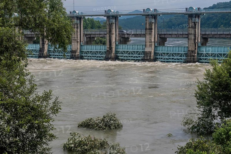 Dam on a river experiencing heavy flood waters and strong currents, in South Korea