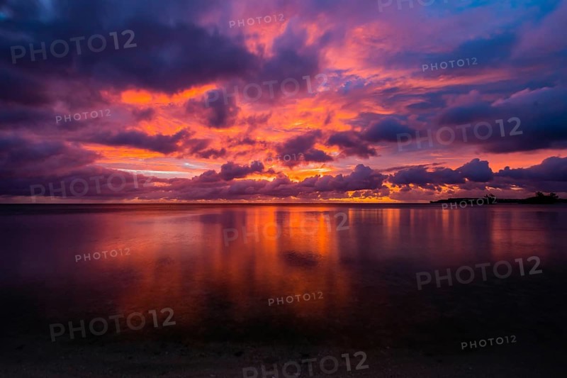 Beautiful sunset over ocean water taken from a beach in Guam