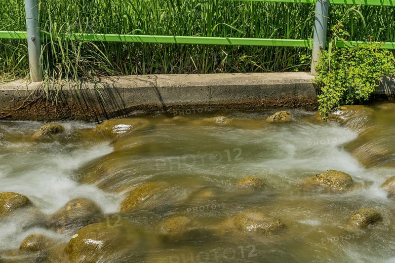 Close-up of a stream with water flowing over rocks, in South Korea