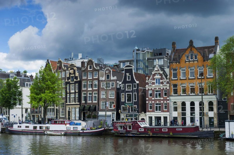 View of the Amstel with typical canal houses, boat, facade, house, property, downtown, centre, old town, building, typical, travel, city trip, tourism, big city, urban, world heritage site, canal, city centre, city view, Amsterdam, Holland, Netherlands