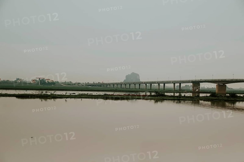 Cinematic dark and moody scenery of a bridge over the river in Ninh Binh, Vietnam, Asia