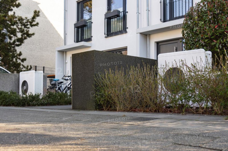 Two heat pumps in the front garden of terraced houses in Duesseldorf, North Rhine-Westphalia, Germany, Europe