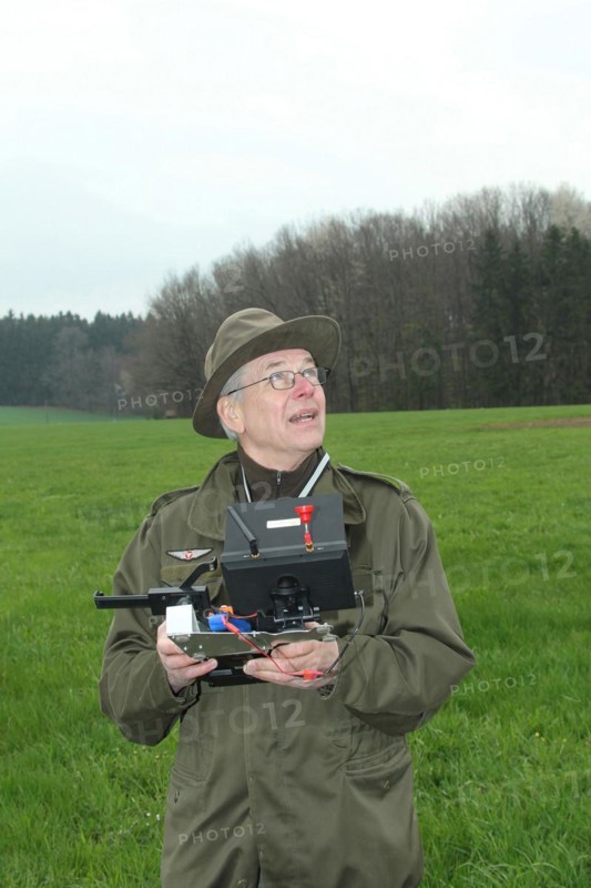 Hunter observes and controls flying drone during a hare (Lepus europaeus) census, Lower Austria, Austria, Europe