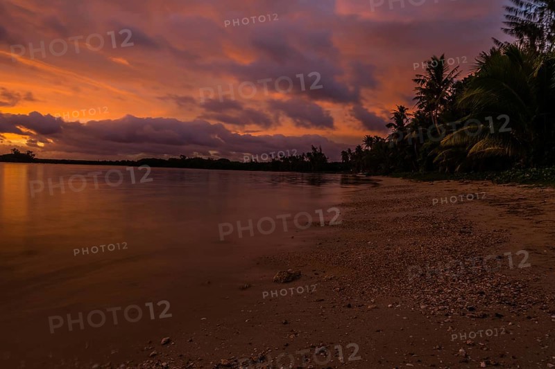 Beautiful sunset over ocean water taken from a beach in Guam