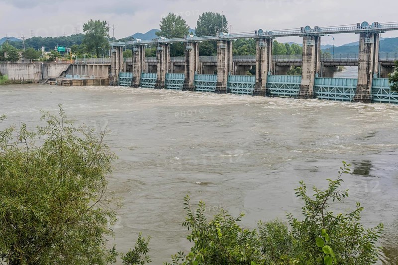 Hydroelectric dam managing rising floodwaters in a swollen river, in South Korea