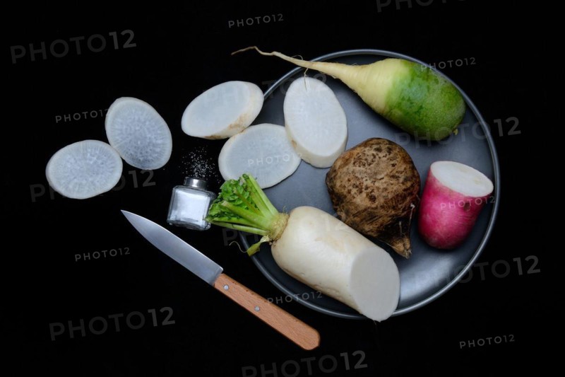 Various radishes on a plate, sliced, Raphanus