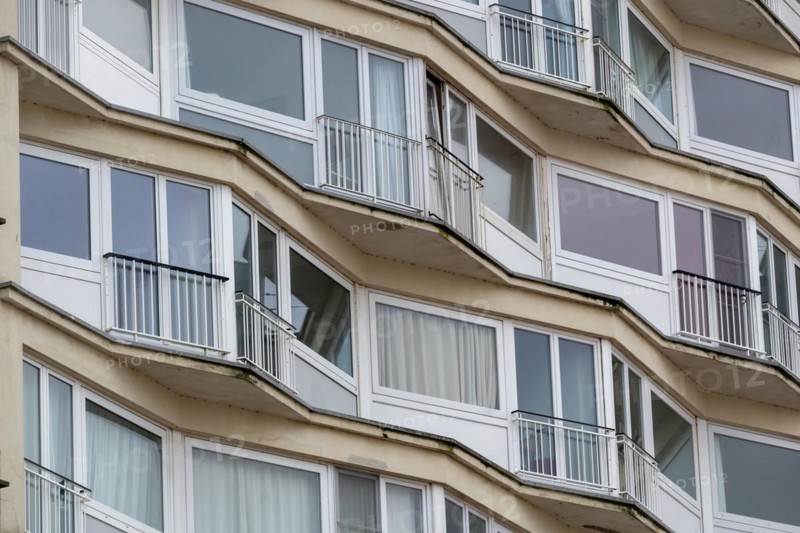 Curved residential building with curved balconies and reflective windows, Blankenberge, Flanders, Belgium, Europe