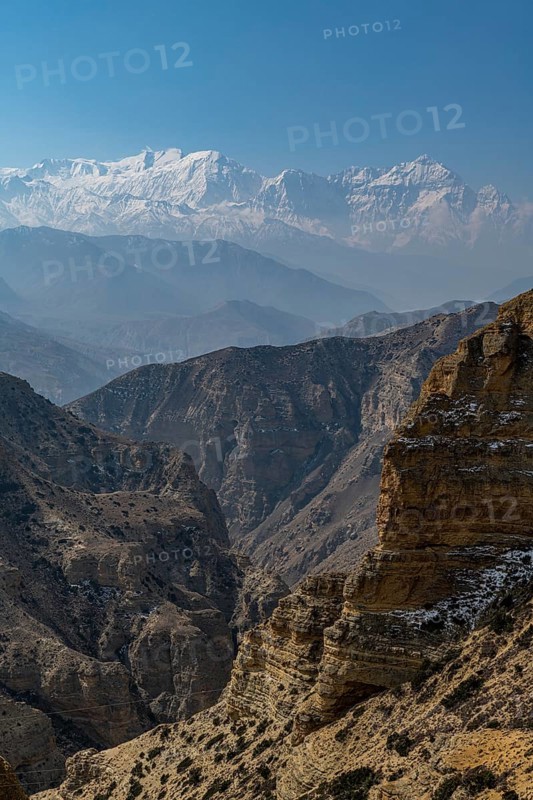Desert mountain scenery with the Annapurna mountain range in the background, Kingdom of Mustang, Nepal, Asia