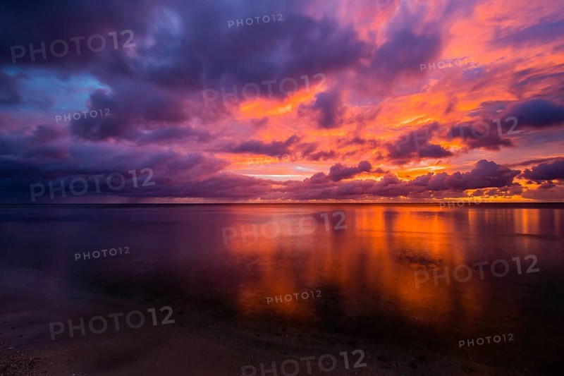 Beautiful sunset over ocean water taken from a beach in Guam