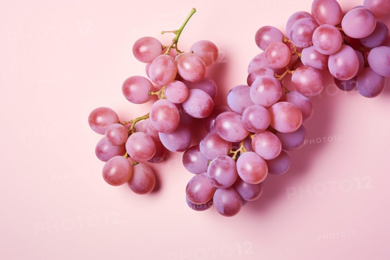 Top view of grape fruits on pastel pink background. KI generiert, generiert AI generated