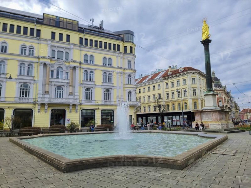 Graz, Austria, 26.03.2023: Mary's Column and fountain in Jakominiplatz Square, famous attraction in the city center of Graz, Steiermark region, Austria, Europe