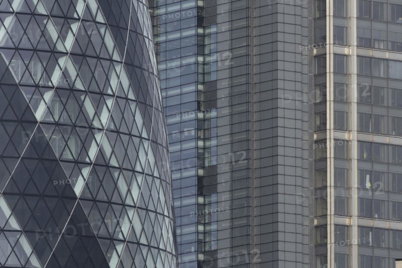 The Gherkin skyscraper building and nearby high rise office building, City of London, England, United Kingdom, Europe