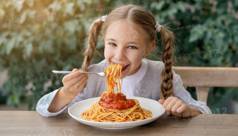 KI generated, A girl, 10, years, eats a plate of spaghetti with relish
