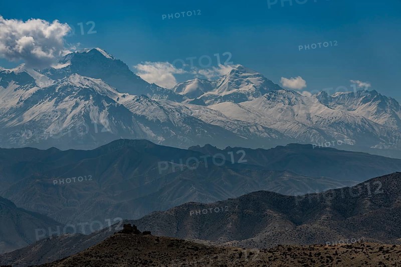 Old fortress in the desert landscape before the Annapurna mountain range, Kingdom of Mustang, Nepal, Asia