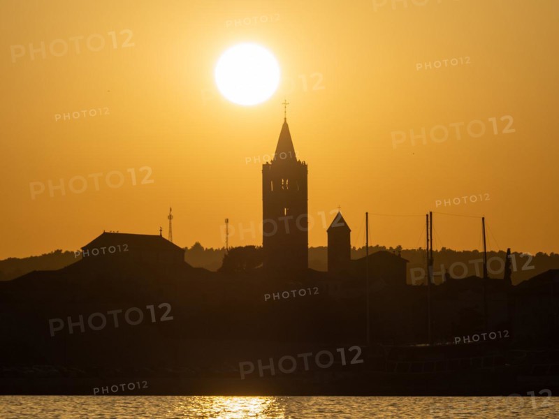 Golden evening light at sunset, silhouette of the church towers of Rab, town of Rab, island of Rab, Kvarner Gulf Bay, Croatia, Europe