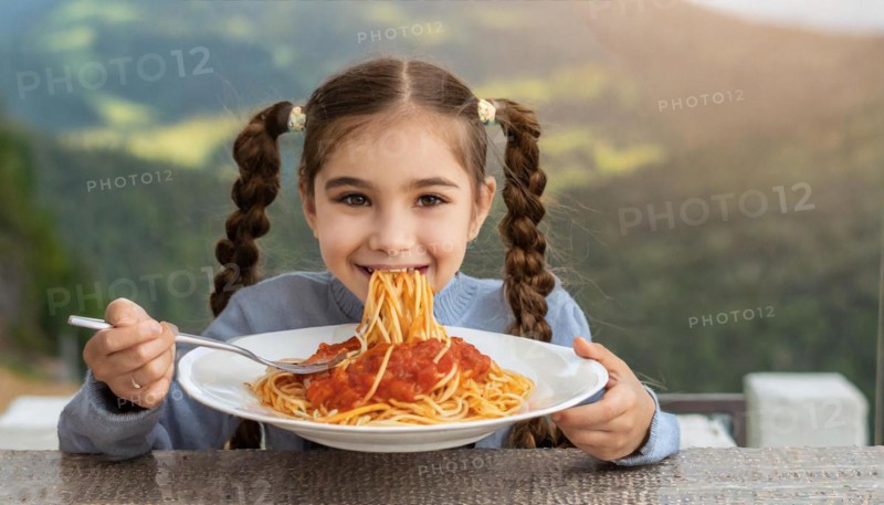 KI generated, A girl, 10, years, eats a plate of spaghetti with relish