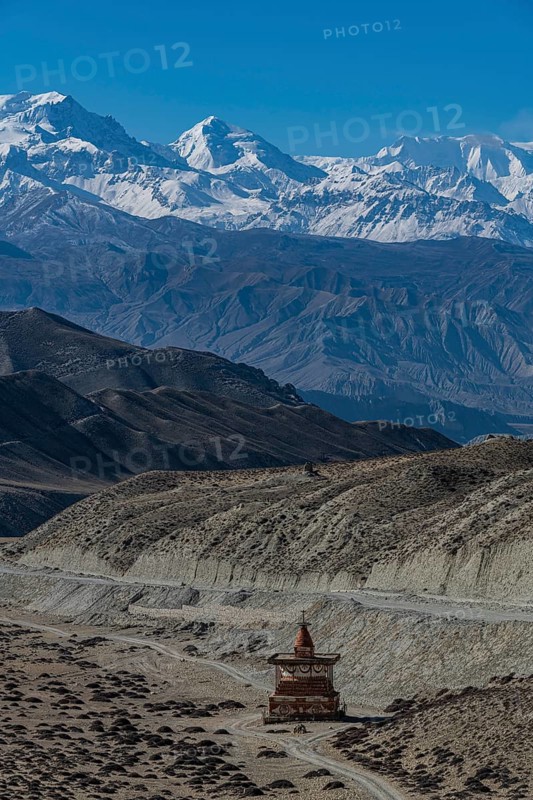 Stupa in a desert landscape before the Annapurna mountain range, Kingdom of Mustang, Nepal, Asia