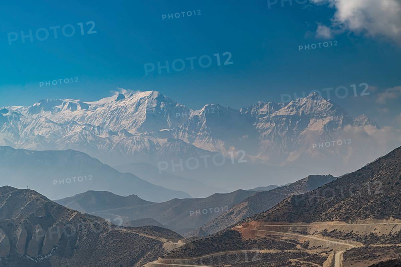 Desert mountain scenery with the Annapurna mountain range in the background, Kingdom of Mustang, Nepal, Asia