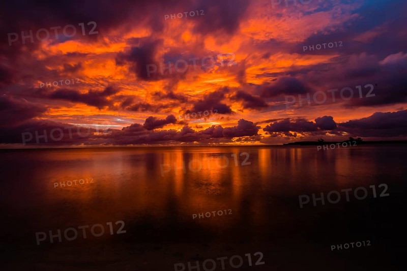 Beautiful sunset over ocean water taken from a beach in Guam