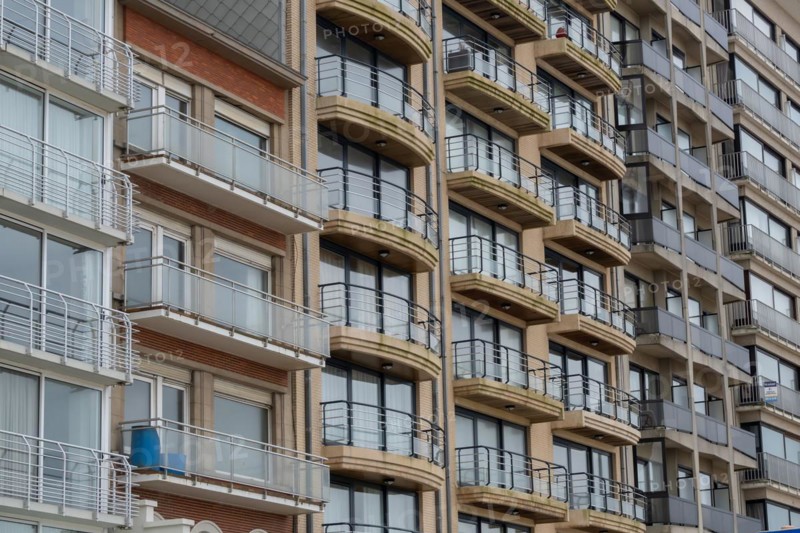Close-up of a multi-storey building with balconies and brick facade, Blankenberge, Flanders, Belgium, Europe