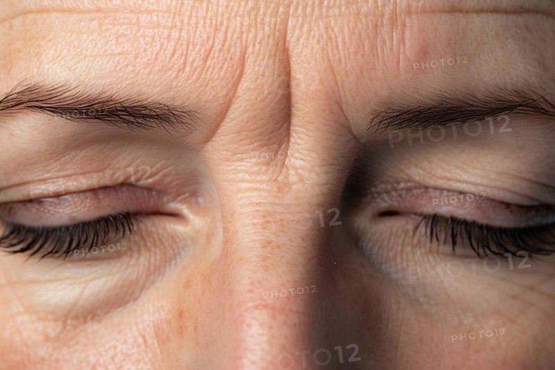 Close up of frown line wrinkles between eyes and eyebrows of middle-aged woman. KI generiert, generiert AI generated