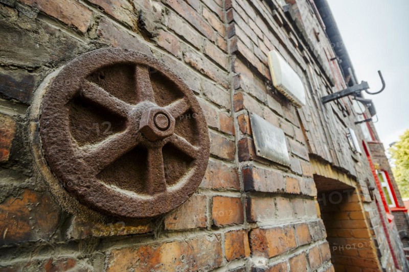 Metal rusted ankra protects house from damage on wobbly post-mining land, Katowice, Nikiszowiec, Silesia, Poland, Europe