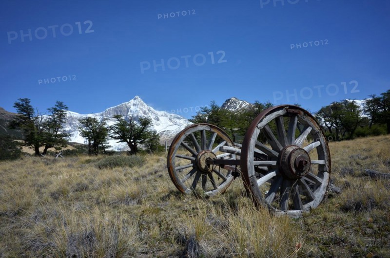 Old wooden cart in front of the snow-covered Monte San Lorenzo, Perito Moreno National Park, Patagonia, Argentina, South America