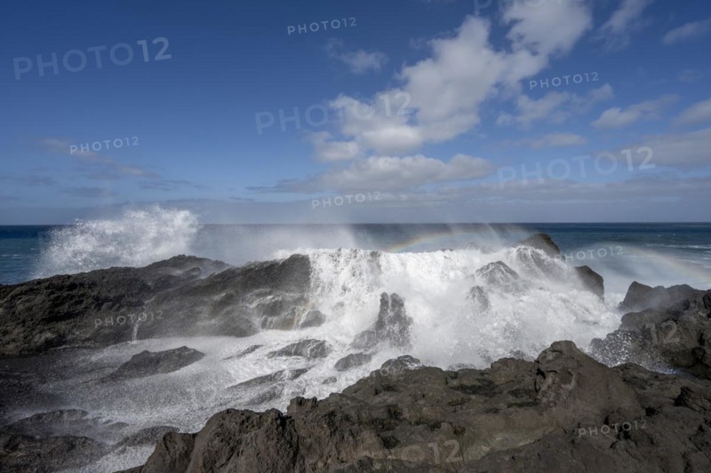 Surf with rainbow, near Los Hervideros, Lanzarote, Canary Islands, Spain, Europe