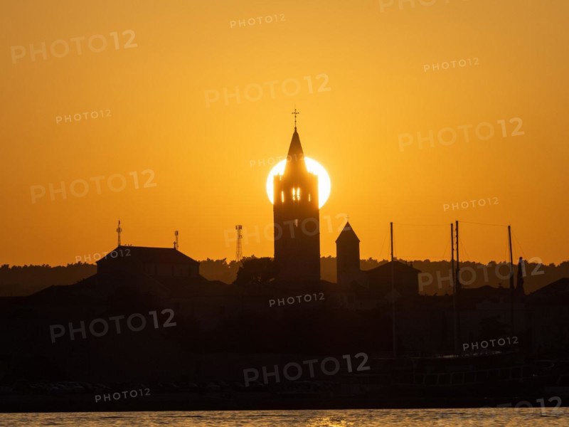 Golden evening light at sunset, silhouette of the church towers of Rab, town of Rab, island of Rab, Kvarner Gulf Bay, Croatia, Europe
