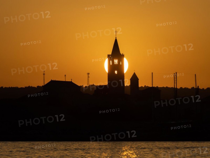 Golden evening light at sunset, silhouette of the church towers of Rab, town of Rab, island of Rab, Kvarner Gulf Bay, Croatia, Europe