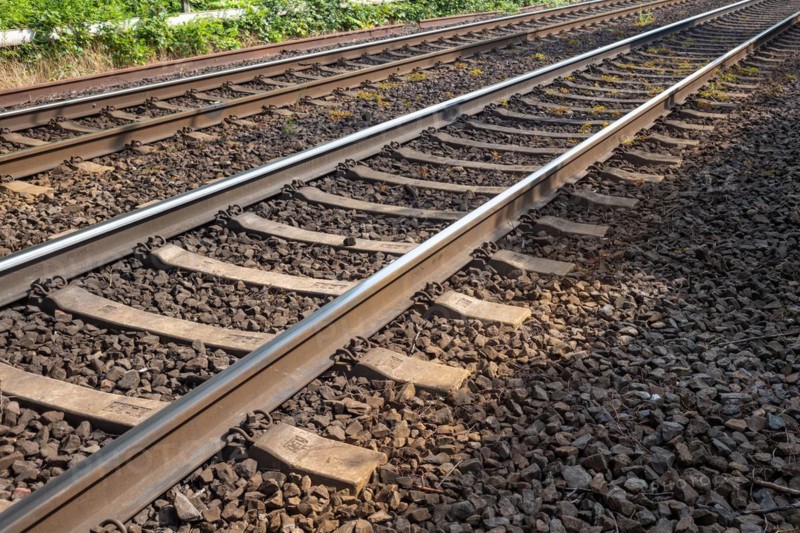 Railway tracks with wooden sleepers and ballast bed stretching into the distance, Oberhausen, North Rhine-Westphalia, Germany, Europe