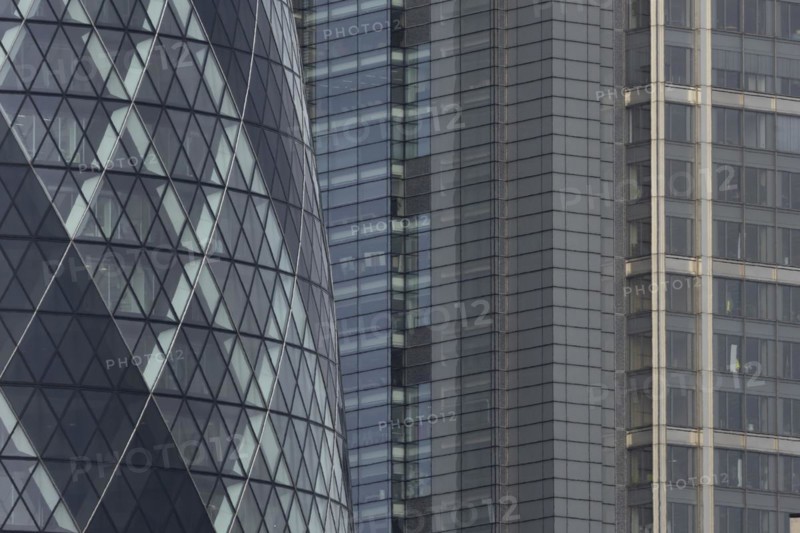 The Gherkin skyscraper building and nearby high rise office building, City of London, England, United Kingdom, Europe